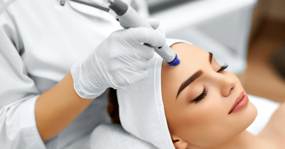 Woman receiving a Hydration Facial treatment at a spa in Geneva, IL